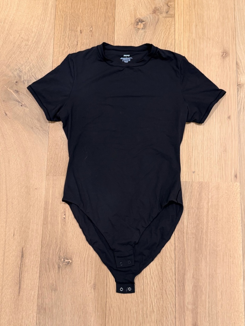 SKIMS Black Short Sleeve Bodysuit Stretch Crew Neck Snap Closure Essential Tee